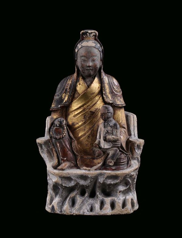 Polychrome earthen Guanyin lighted with gold, China, Ming Dynasty, 17th century h cm 33
