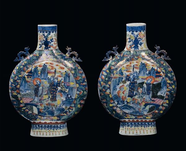 Pair of Ducai porcelain flasks, China, Qing Dynasty, 19th century decoration with windows and religious scenes, handles in the shape of marine animals, neck with stylized dragons, h cm 48,5