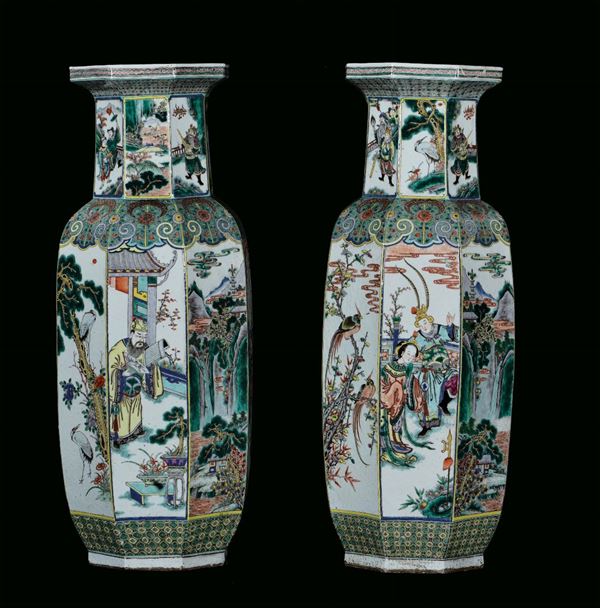 Pair of Famille Verte porcelain vases with exagonal section, China, Qing Dynasty, 19th century decoration with figures, landscapes and birds on branches, h cm 94
