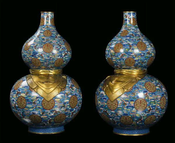Pair of large pumpkin cloisonné and gilt bronze vases, China, Qing Dynasty, 19th century, decoration with Taoist symbols on light blue background, h cm 82