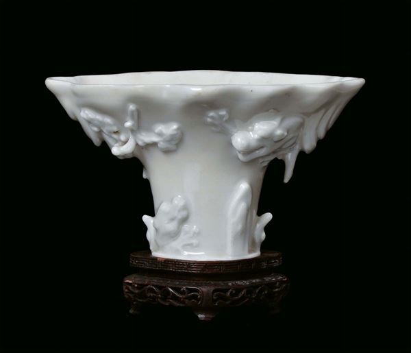 Blanc de Chine porcelain cup with animal figures, wooden base, China, Dehua, Kangxi period ( 1662-1722) h cm 25