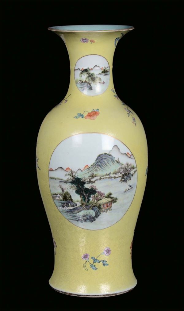 A porcelain vase decorated with yellow background, China, 19th centuryPolychrome landscapes within reserves, single character mark under the base, apocryphal Qianlong mark