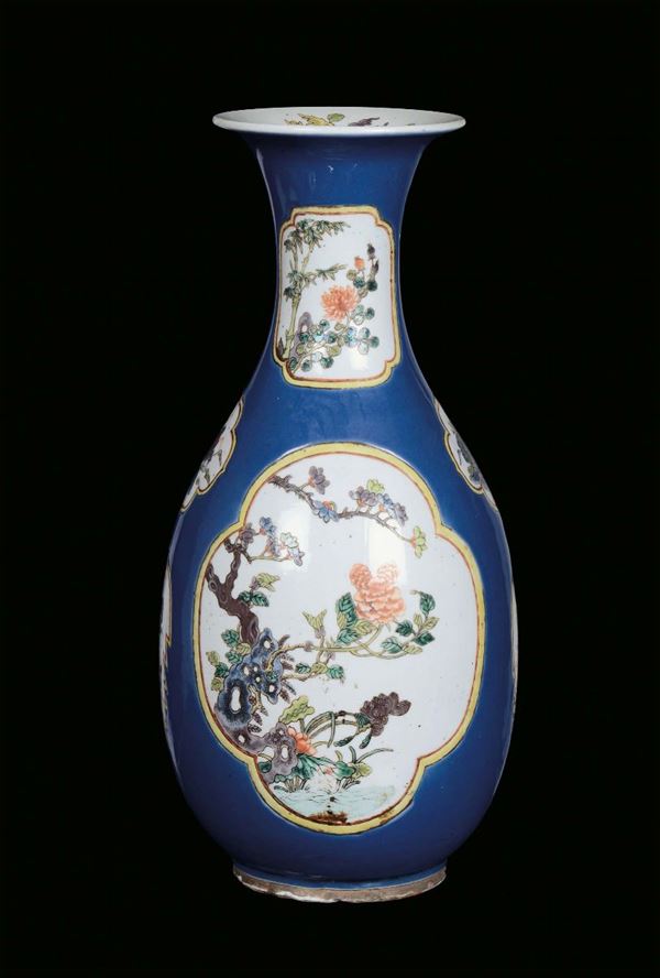 Porcelain vase decorated with blue background, China, Qing Dynasty, 19th centuryVegetable and floral motives within reserves with Famille Verte tones