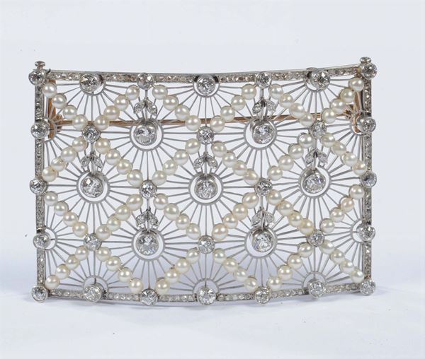 A rectangular open work decorated with pearl, old brilliant single and rose-cut diamonds