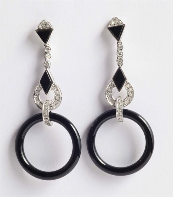 A pair of onix and diamond pendent earrings