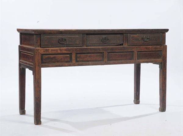 A wooden console, China, 19th century. Rectangular top, three drawers on the stripe