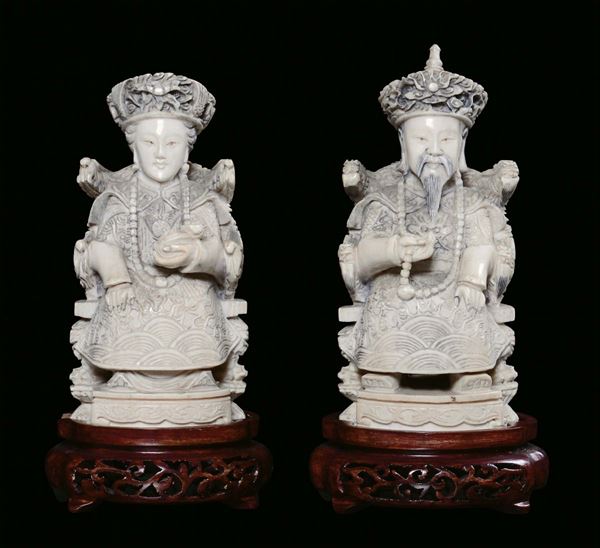 A pair of ivory sculptures representing rulers, China 19th-20th century