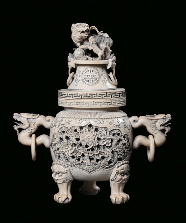 An ivory sculpted censer, China 20th century. Cover and handles in the shape of dragons