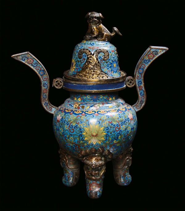 A gilt bronze and cloisonné enamels censer, China, Qing Dynasty, 19th centuryOval body placed on three feet with elephant heads, stylized vegetable decoration on light blue background, gilt bronze Pho dog on the cover