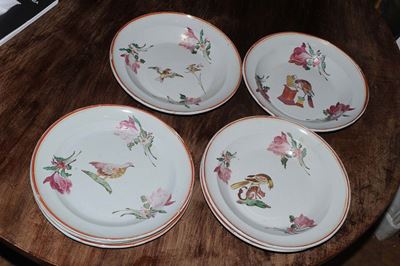 Sette Piatti in Maiolica Policroma