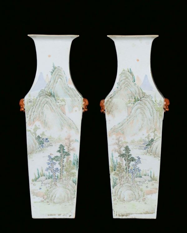 A pair of polychrome porcelain vases, squared section, China, Qing Dynasty, 19th century,Oriental landscape decorations