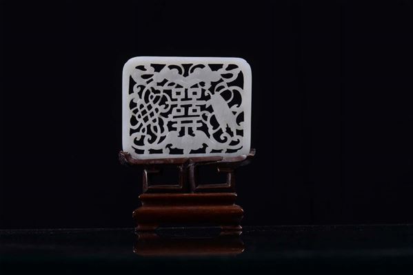 A small fretworked jade plaque, China early 20th century