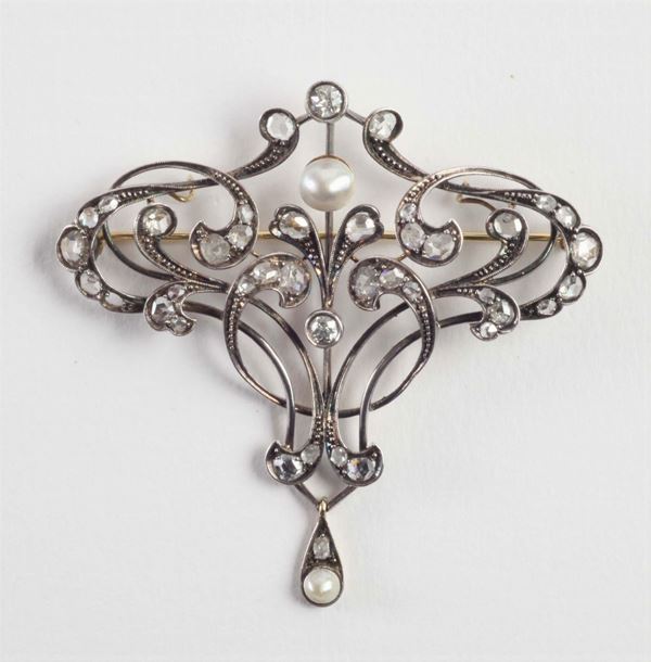 An Art Nouveau silver and pearl brooch