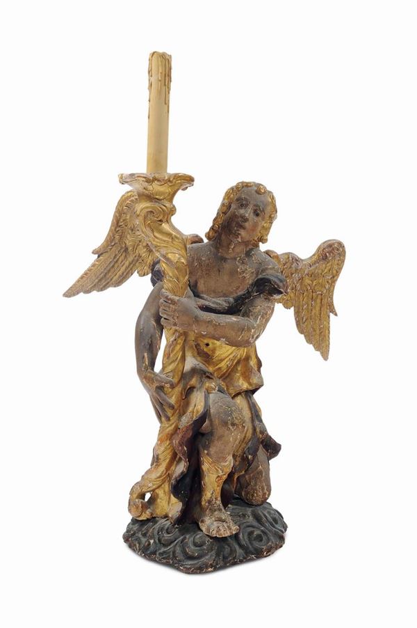 Angelo reggicero in legno intagliato, laccato e dorato,  XVII secolo