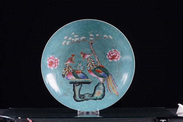 A large polychrome dish with light blue background, 19th century