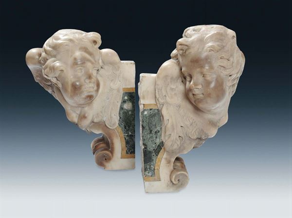 Coppia di teste di putti in marmo, Genova XVII secolo