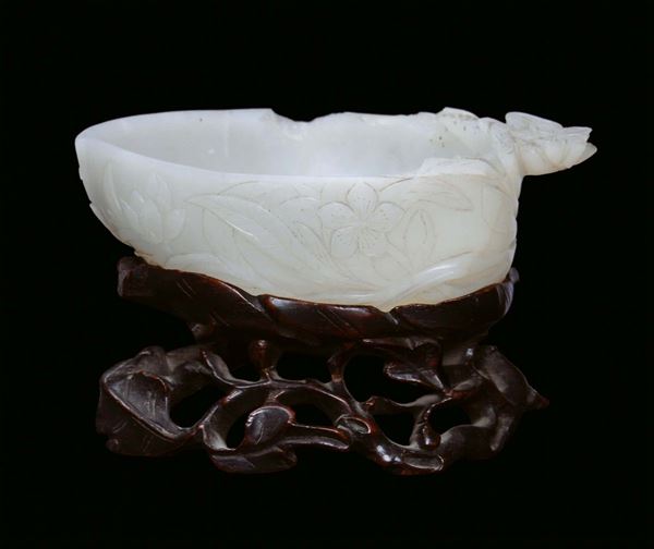 A sculpted jade plate with archaic motives, China, Qing Dynasty, Qianlong Period (1736-1795)