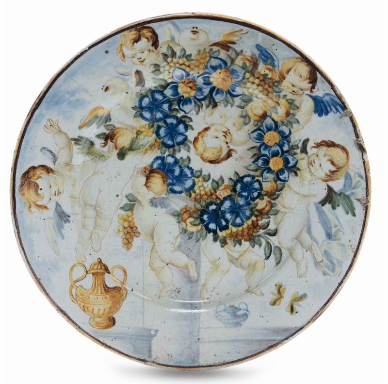 Piattino in maiolica con putti e fiori, Castelli XVIII secolo  - Asta Maioliche Italiane dal XVI al XVIII Secolo - Cambi Casa d'Aste