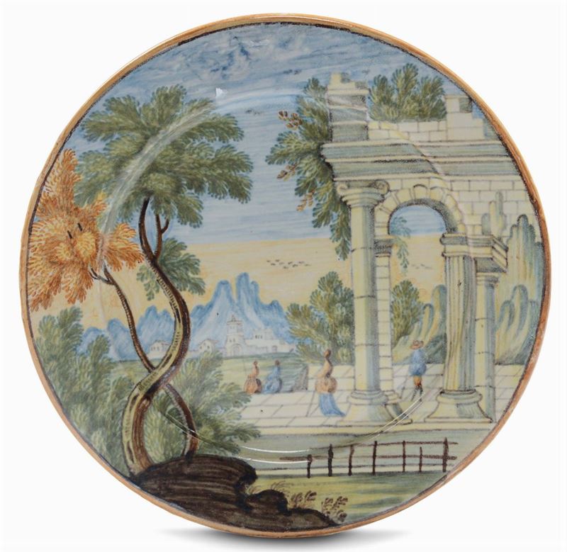 Piattino in maiolica decorato con paesaggio e architetture, Castelli XVIII secolo  - Asta Maioliche Italiane dal XVI al XVIII Secolo - Cambi Casa d'Aste