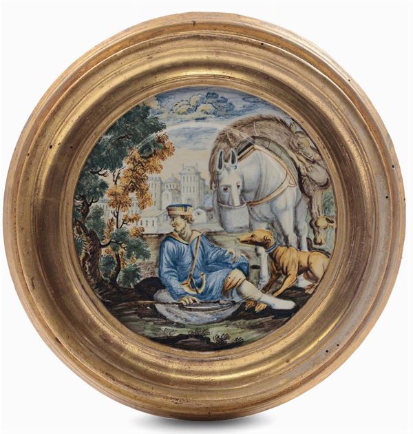 Disco in maiolica raffigurante cacciatore con cane, Castelli XVIII secolo