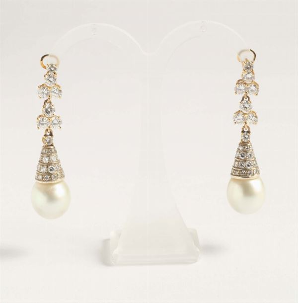 A pair of pearl and diamond pendent earpendants