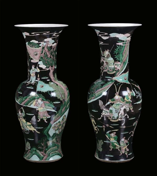 A pair of porcelain Famille Noire vases, China, Qing Dynasty, end 19th century apocryphal Kangxi mark