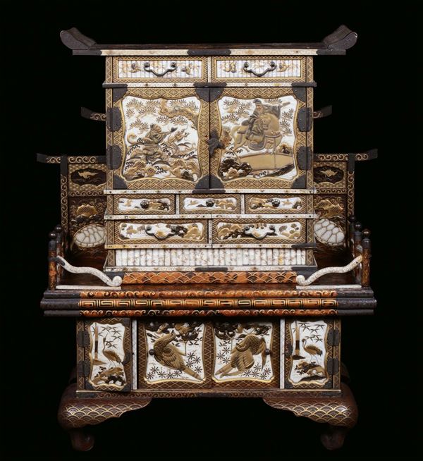 A lacquer and ivory cabinet-on-stand finely decorated with landscapes and figures, Japan, Meji Period, late 19th century