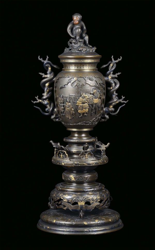 An important bronze vase with gold, silver and copper insertions, Japan, Meji Period, end 19th century. Handles in the shape of branches with snakes, cover with a sitting monkey