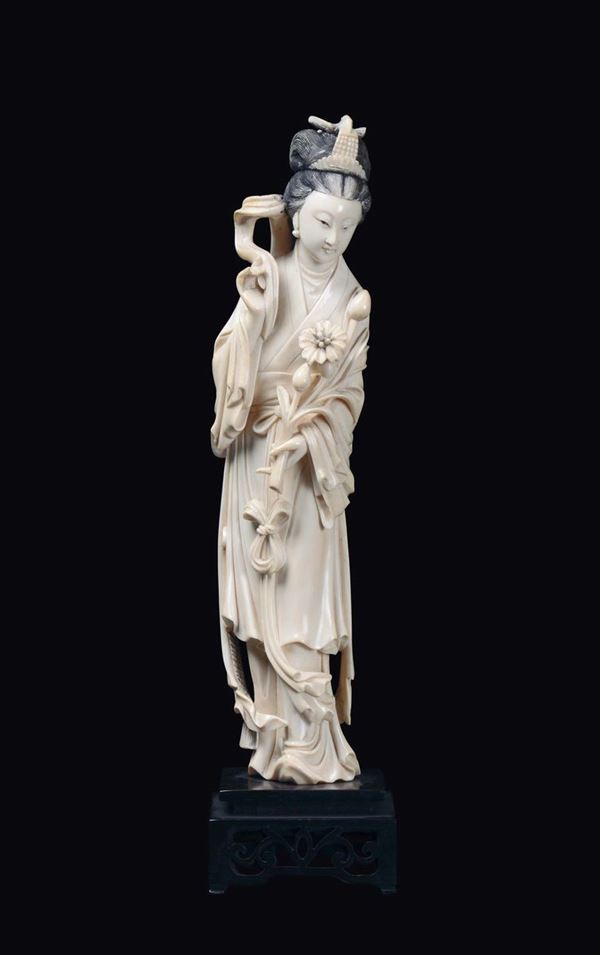A carved ivory Guanyin figure, China, early 20th century