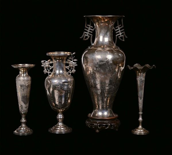A lot formed by four silver vases and two small cups with dishes carved with naturalistic motives, China, Qing Dynasty, 19th century. Different dimensions, punched