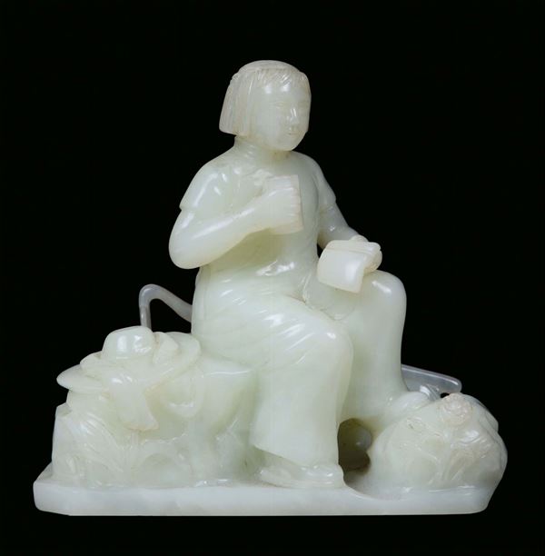 A white jade sculpture representing a sitting child, China, Republic, 20th century