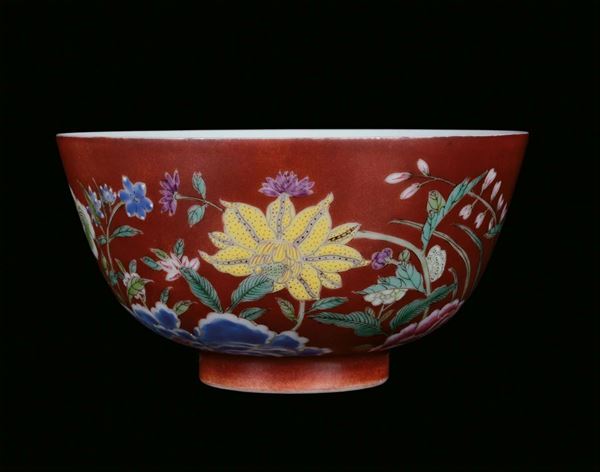A small porcelain bowl with red background and naturalistic decorations, China, Qing Dynasty, 19th centuryapocryphal Qianlong mark