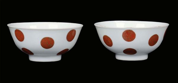 A pair of white porcelain bowls with red and gold rosette decoration, China, Qing Dynasty, Qiannlong Period ( 1736-1795) Ruj Symbol