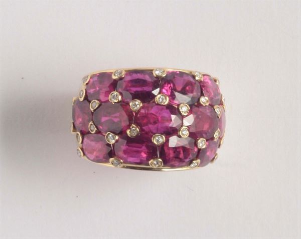An ruby and diamond band ring