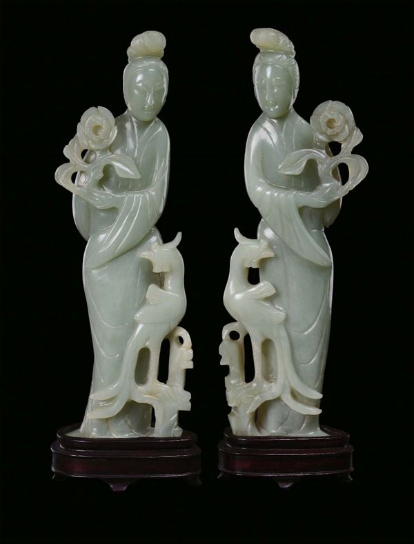 A pair of green jadeite Guanyin, China, Qing Dynasty, 20th century 