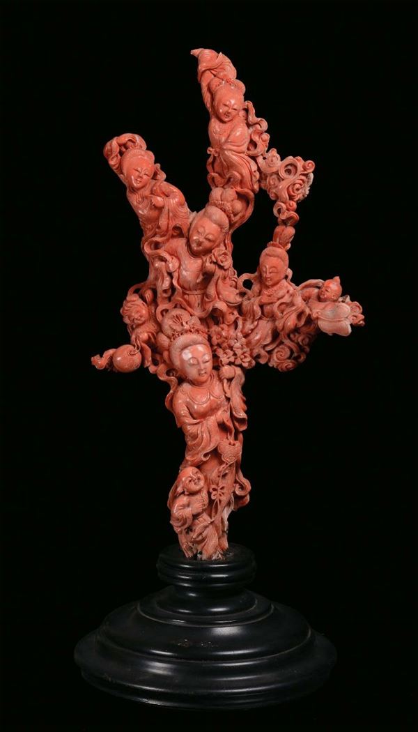 A large red coral group sculpted representing Guanyin with children, China, Qing Dynasty, 19th century