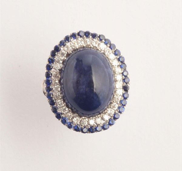 A cabochon lapis lazuli, diamond and shappire cluster ring