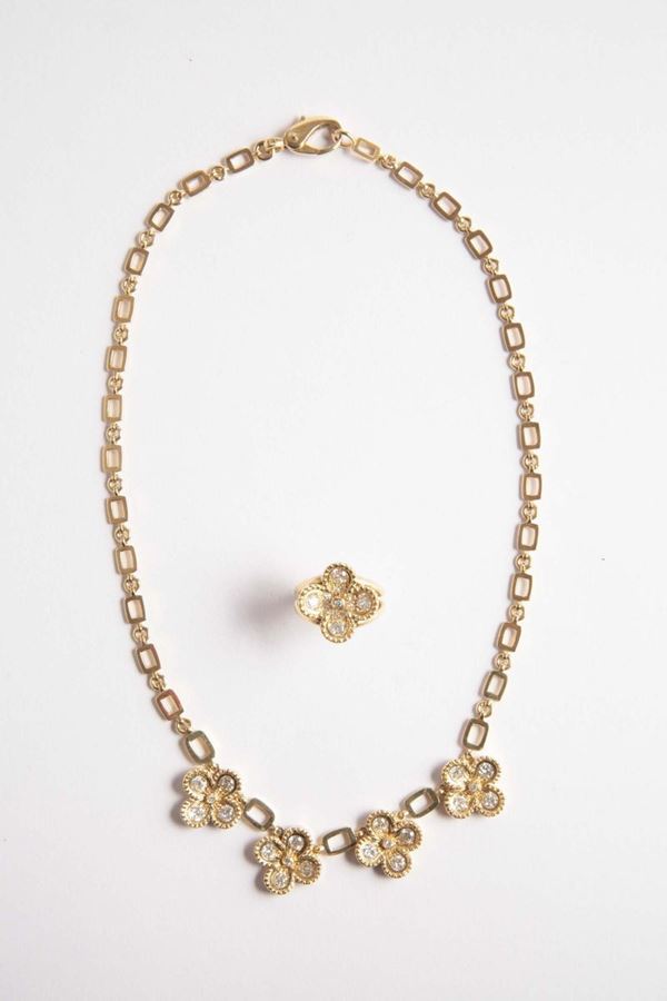 A gold and diamond four-leaf clover necklace and ring