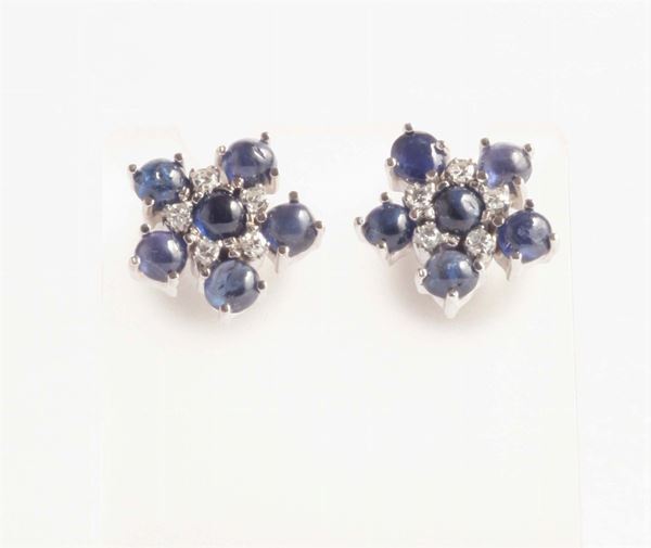 A pair of cabochon shappire and diamond earring