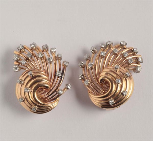 A pair of diamond and gold earrings. 1935 circa