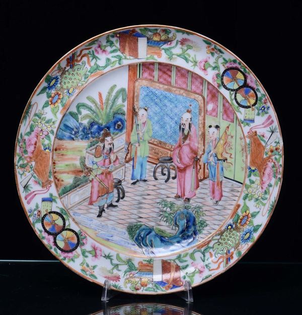 A porcelain dish with Canton decoration, China, Qing Dynasty, 19th century