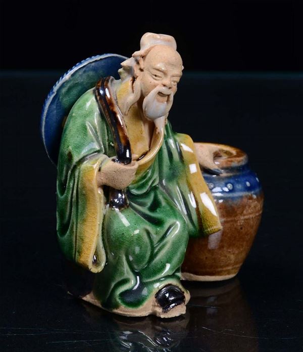 A small statuette representing a person, China 20th century