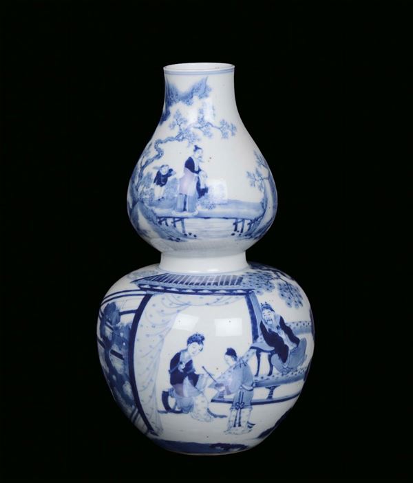 A white and blue porcelain double pumpkin vase with figures, China, 19th century apocryphal Qianlong mark