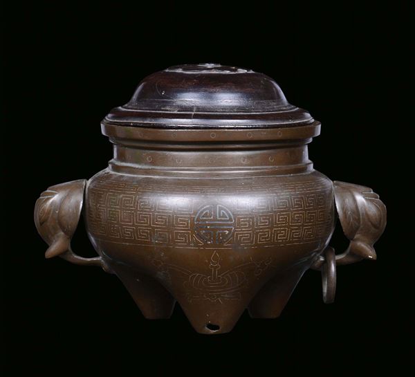 A bronze censer with wooden cover and handles in the shape of elephant heads, China, Qing Dynasty, 18th century