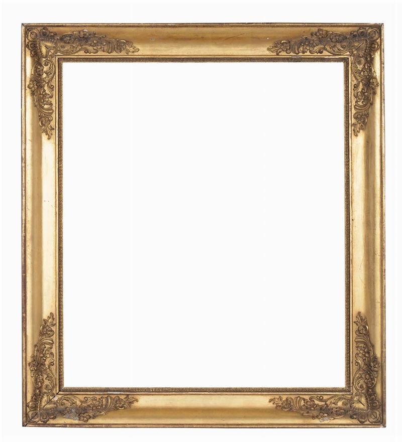 Cornice Impero dorata con decoro in pastiglia agli angoli, XIX secolo  - Auction Antique Frames from 16th to 19th century - Cambi Casa d'Aste