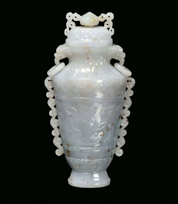 A Celadon green jade vase and a cover, Mogul taste with archaic motives, China, Qing Dynasty, 19th century