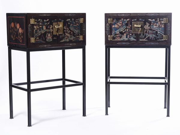Two cabinets-on-stand lacquered on black background and iron base, China, 20th century