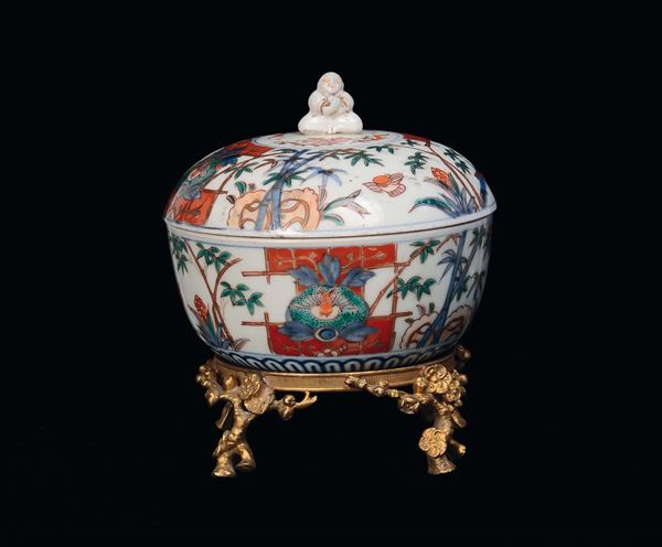 A porcelain bowl with bronze base and two porcelain and bronze cups, China, Qing Dynasty, 19th century