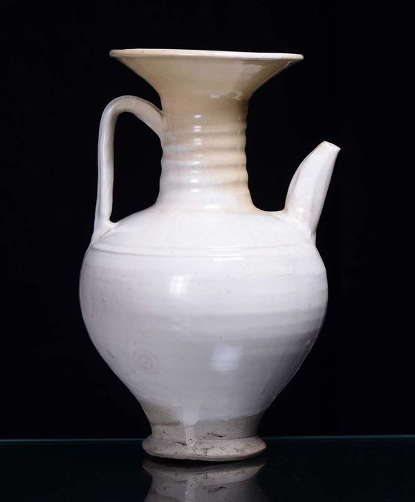 A white ceramic teapot and jug