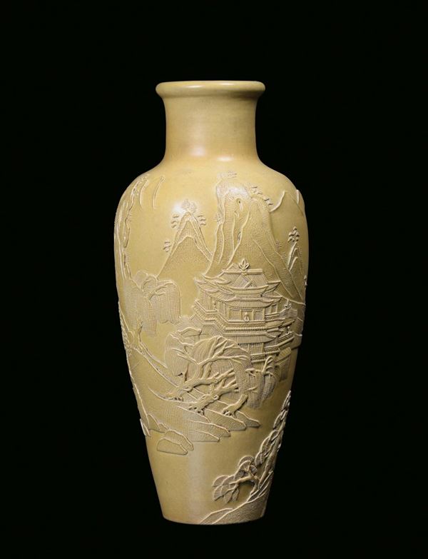 A yellow monochrome biscuit vase with relief oriental landscape decorations, China, Qing Dynasty, 19th century